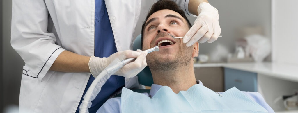 How Often Should You Go to the Dentist? 1 Dentist reviewing a calendar and dental chart with a patient in South San Francisco